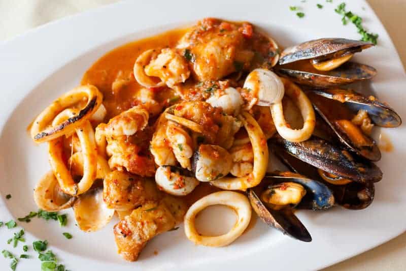 Warm Spanish Food for Christmas, Fresh fried spicy seafood plate mixed diablitos style 