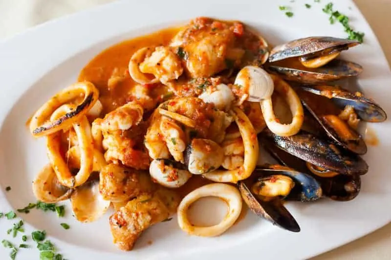 spain food in november with a platter of seafood in sauce