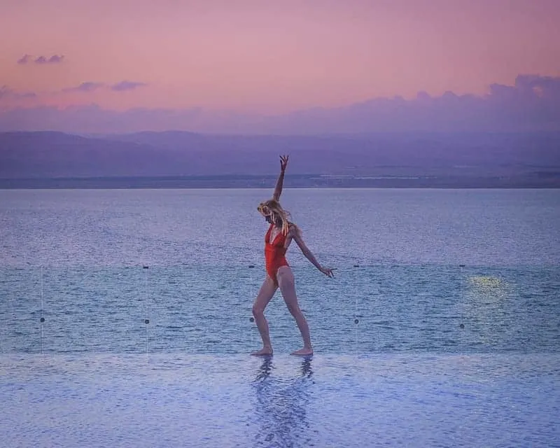 things to do in jordan, infinity pool in dead sea resort, jordan at sunset