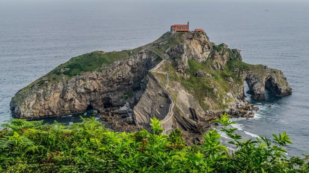 basque country spain, peninsula with house reaching into the sea