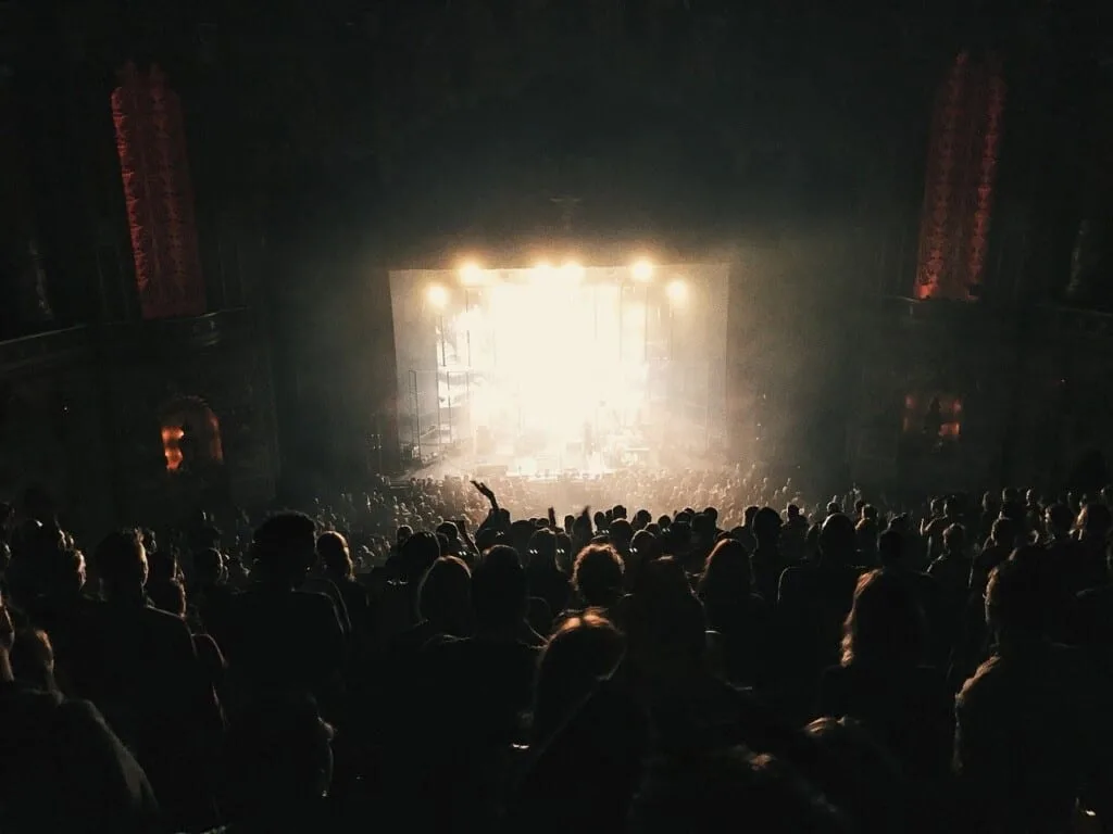 festival in spain, lights during a concert with public in front