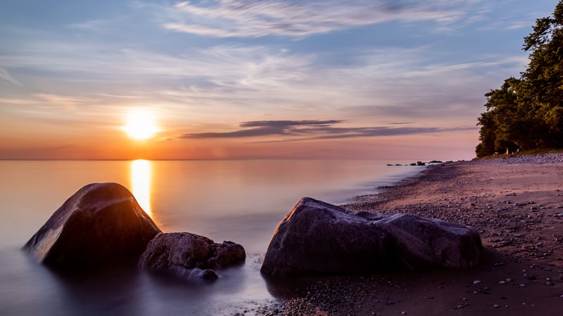 biggest lakes in wisconsin, a misty lake michigan at sunset