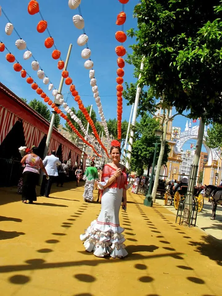 travel blogger girl in spanish dress in seville