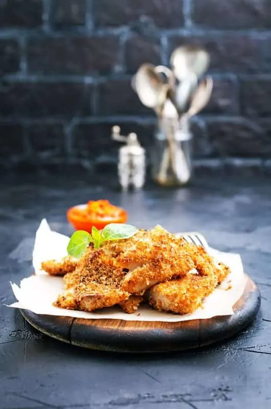 Pan fried fish with tomato sauce on a table, cabo verde food, cape vrde food