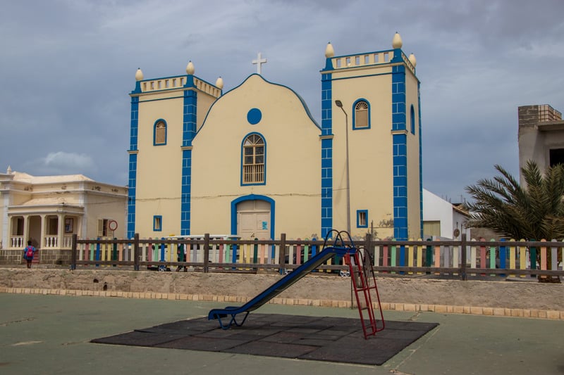 what to do in boa vista, Church in Sal Rei cape verde under a grey sky with a slide in front