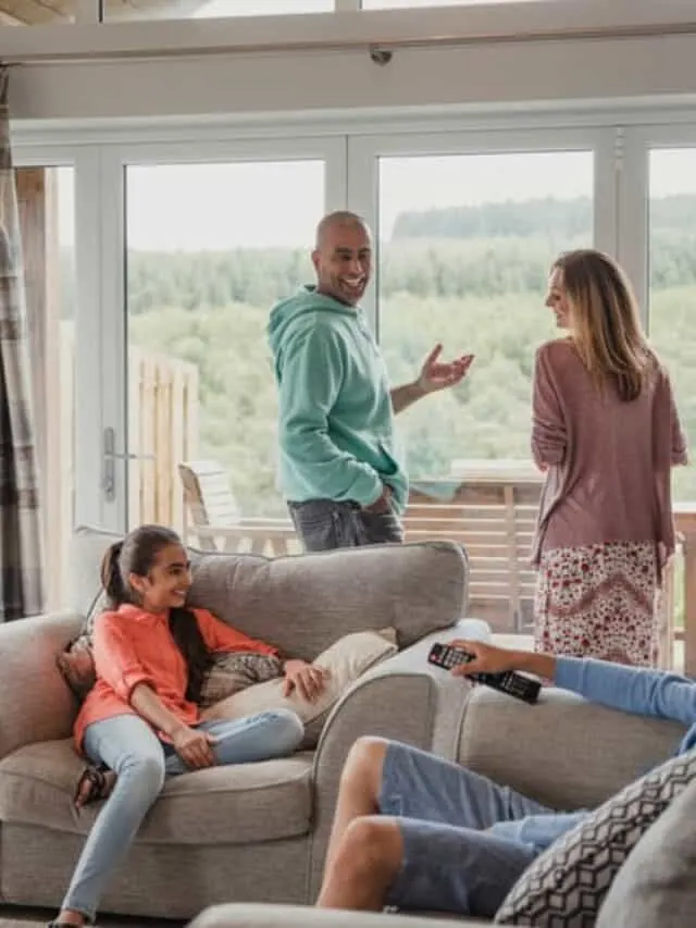 a family chatting in the living room at one of the best family Cabin Resorts in Wisconsin.
