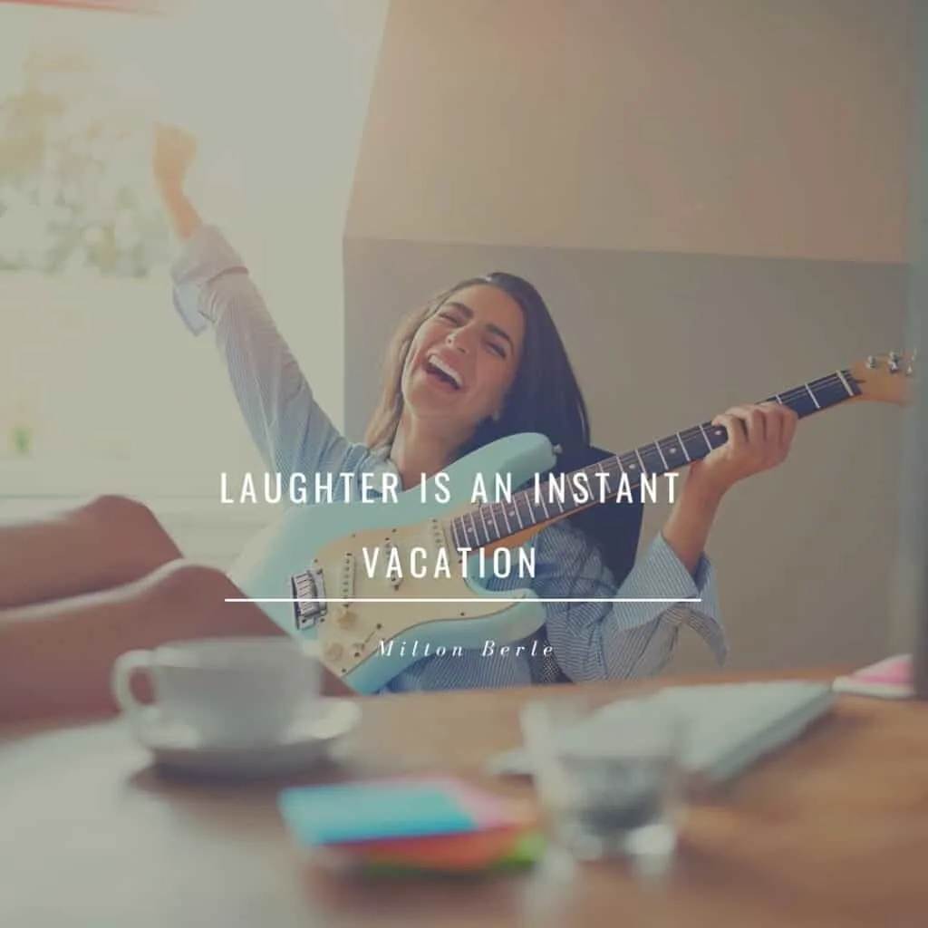 Laughter is an instant vacation; a woman holding an electric guitar stretching and laughing