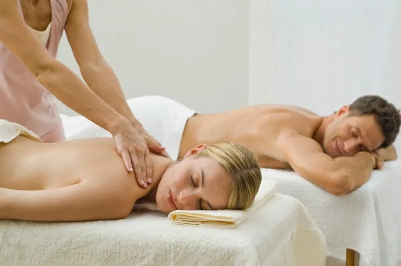 Best staycation ideas for couples, Couple receiving a massage