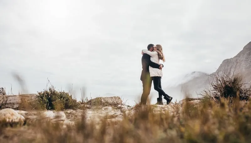 Romantic young couple on beach vacation, staycation couple ideas