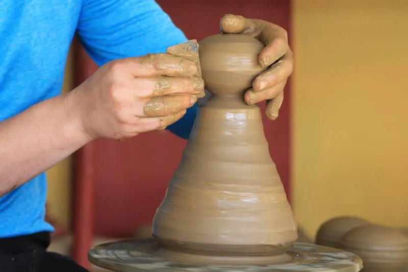 Things to do in Santiago Island, Cape Verde, Man creates vase on clay pottery wheel