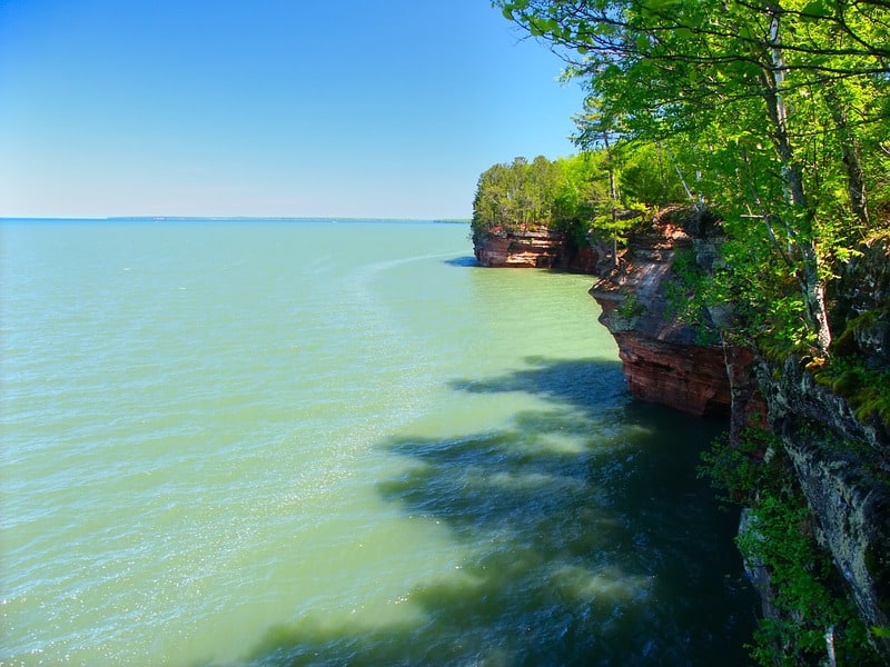 Side view of one Island filled with trees by a lake