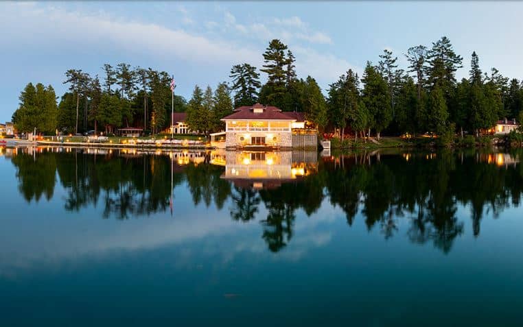 Best Resorts in Door County Wisconsin, Beautiful lakeside view of Gordon Lodge Resort lit up at sunset