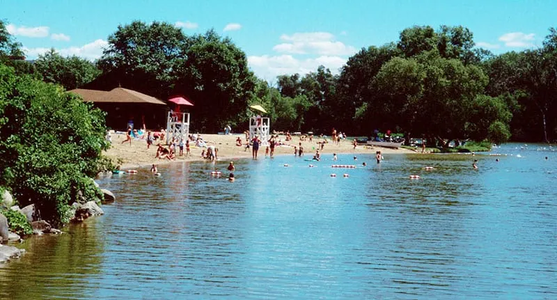 Best Urban Beaches in Wisconsin, View of Vilas Beach with Some people are enjoying a holiday on the beach