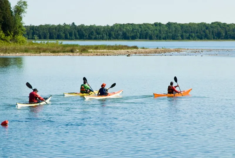 group of people kayaking in door county