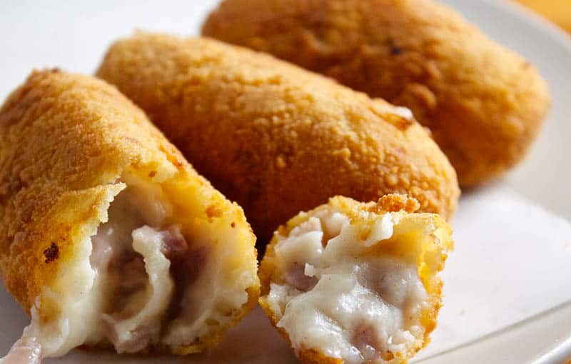 Seek out some famous Spanish food this year, close up shot of Croquetas dish