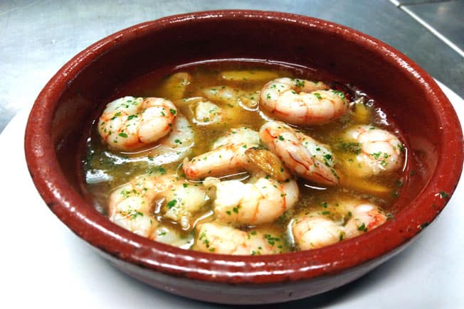 Spain food culture is vibrant and fun, Gambas al Ajillo dish