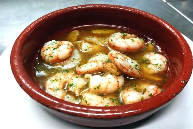 Gambas al Ajillo dish on a red bowl