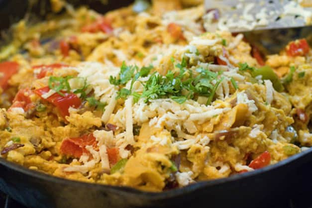 close up shot of Migas dish in metal skillet