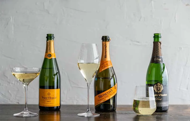 Be adventurous with the traditional food in Spain, three bottles of Cava Sparkling Wine with accompanying wineglasses