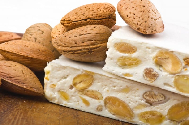 a closeup of Turron dish from Alicante with almonds on a table