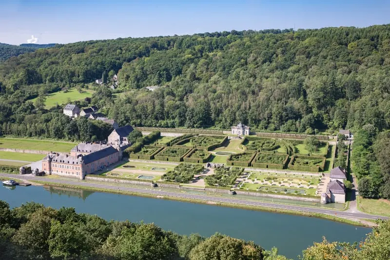 must see castles in belgium, Aerial view chateau Freyr along river Meuse near Dinant in Belgium