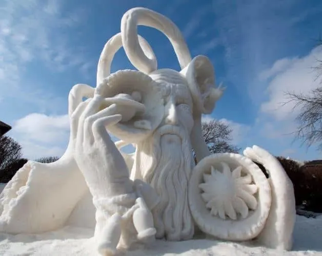 Best places to visit in Lake Geneva in winter, impressively detailed snow sculpture of man holding different objects