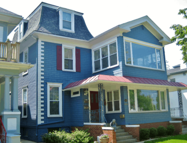 facade of a blue house with big windows of Orson Welles’ Birthplace