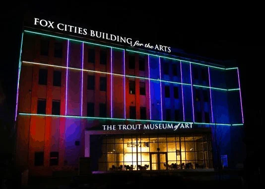 Things to do in Wisconsin, appleton guide, Beautiful view of Trout Museum of Art lit up in red and blue neon lights at night time