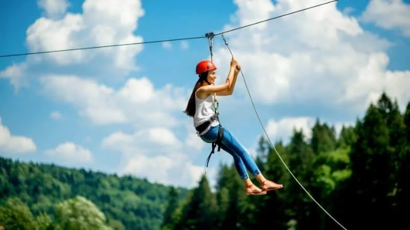 fun outdoor activities in Wisconsin, women riding on a zip line