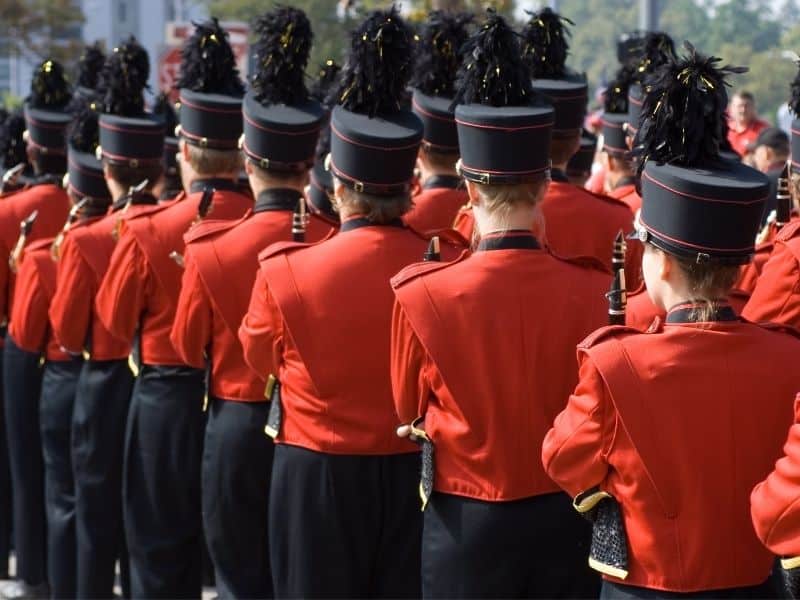 Fun spring events in Wisconsin, band playing during parade dressed in red and black outfits