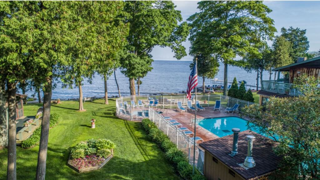 best lakeside resorts in wisconsin, aerial view of pool area overlooking the lake