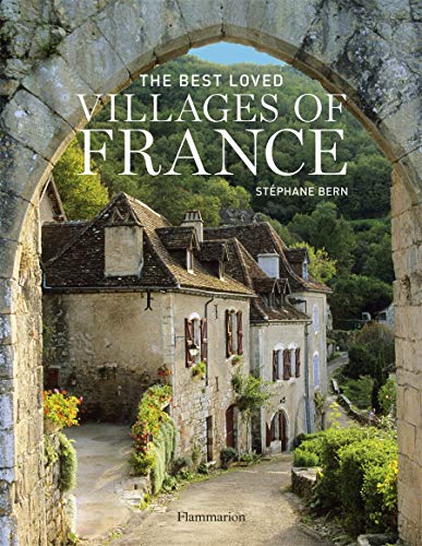 Best France coffee table books, book cover showing stone archway with view of idyllic rural French street with stone buildings with tiled roofs and a backdrop of lush green trees