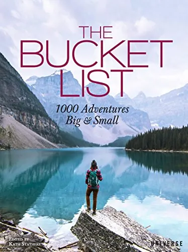 travel books coffee table, book cover showing person in hiking gear with backpack looking out across lake with mountains in the distance
