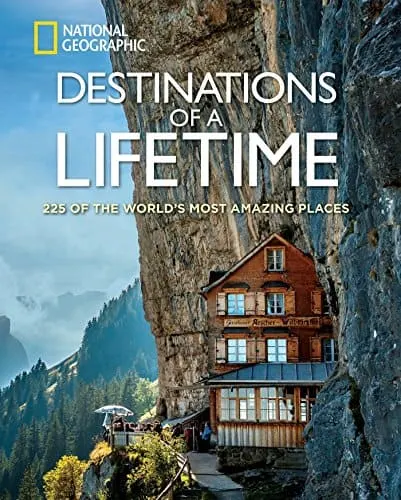 national geographic coffee table books, book cover showing photograph of a wooden house built in the side of a mountain with more mountains in the distance
