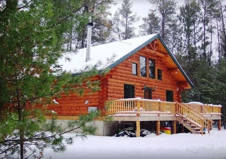 winter getaways in wisconsin, beautiful winter view of Unique Handmade Log Cabin – Hatfield, Merrillan
