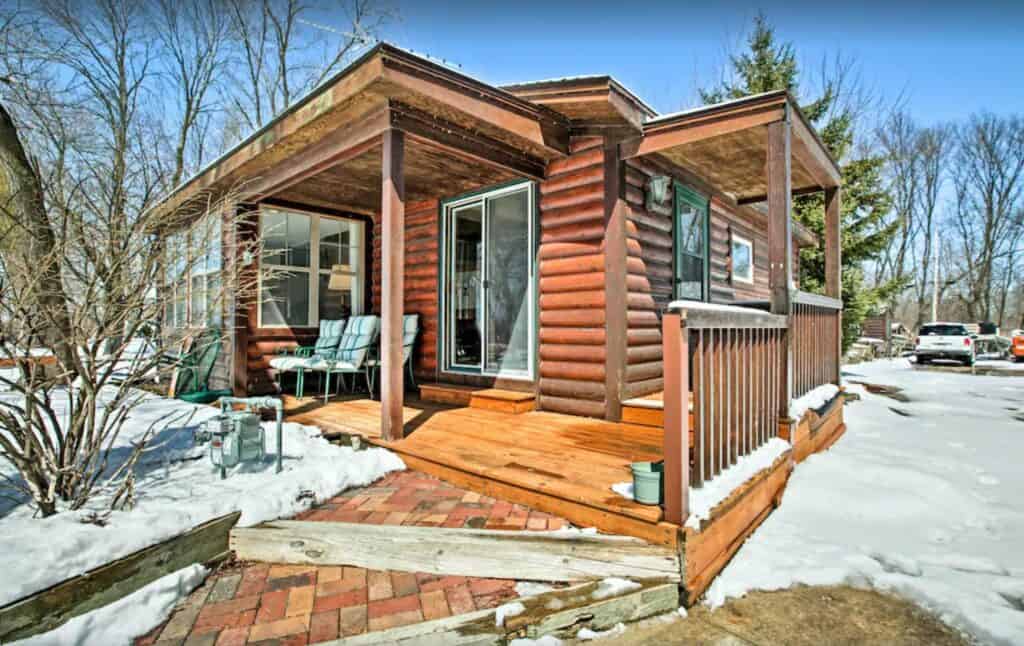 a secluded pet-friendly wooden cabin in Wisconsin covered with snow