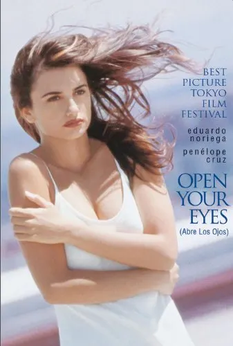 Discover the best spanish romantic movies, movie poster for Abre los Ojos (Open Your Eyes) with woman in white dress wrapping her arms around herself as strong wind blows her hair about