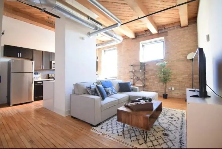 Best Milwaukee Rental for Couples, View of Livingroom in Industrial Loft with King Bed