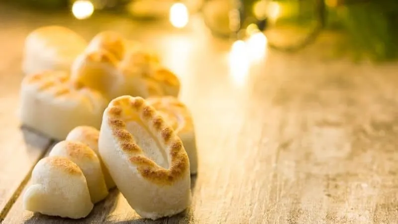 Traditional spanish christmas food, View of Sweets Marzipan with lights on the background