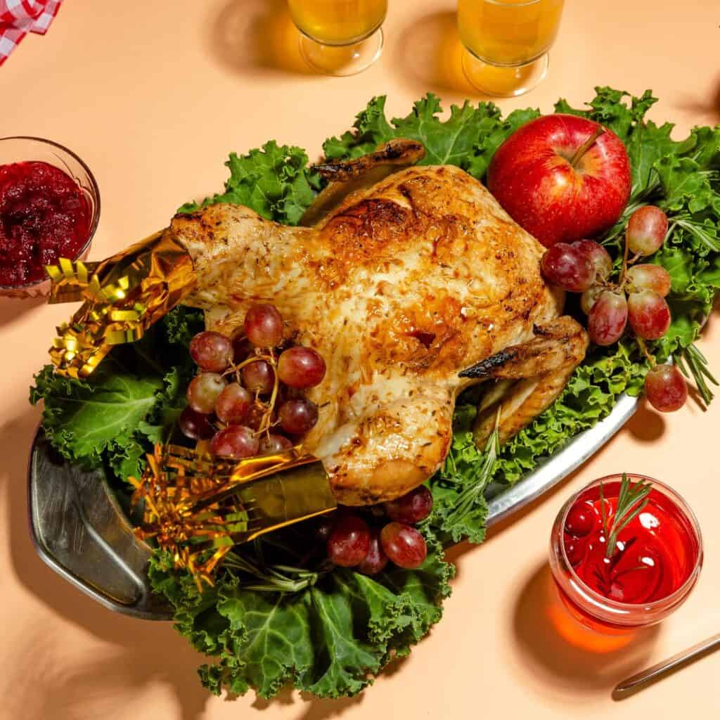 roasted turkey with cranberries and apples on a platter