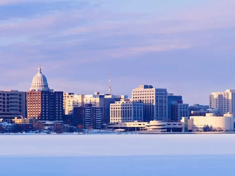 madison in winter, view of downtown Madison from frozen, snow-covered lake