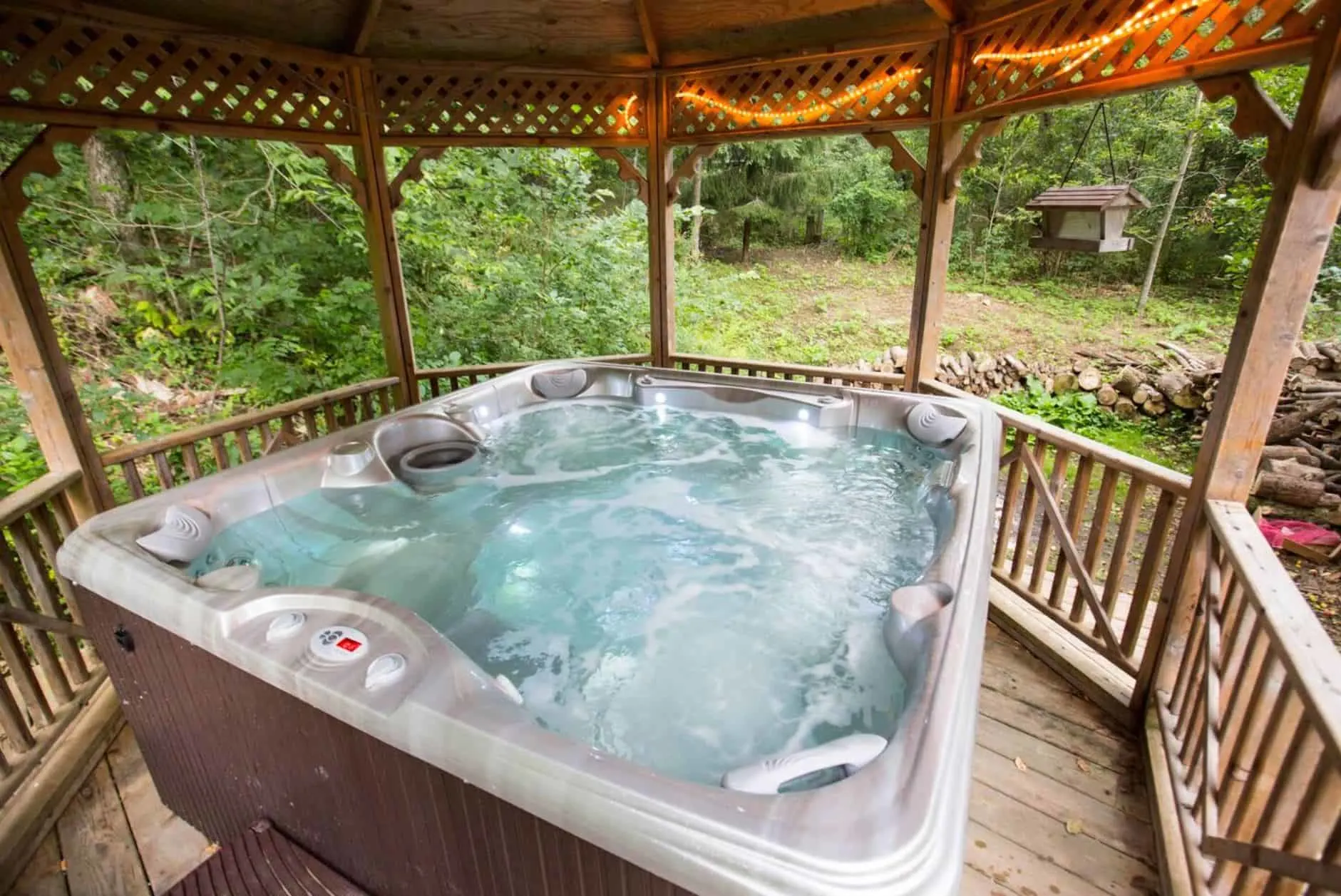 Wisconsin Dells Cabins with Hot Tubs, view with a hot tub on a porch