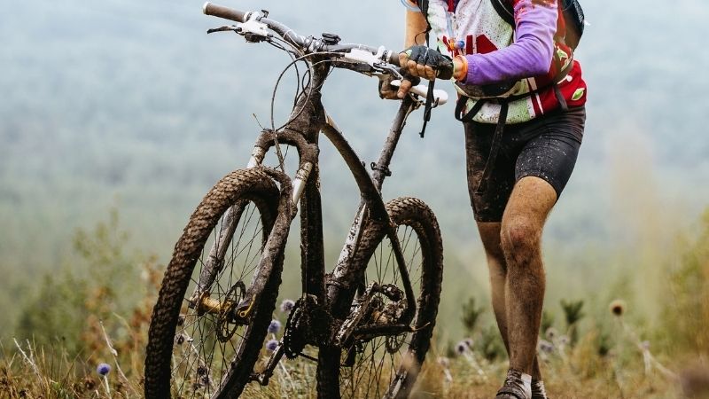 Best Wisconsin Mountain Bike Trails, A men Mountain Biking in a Hill