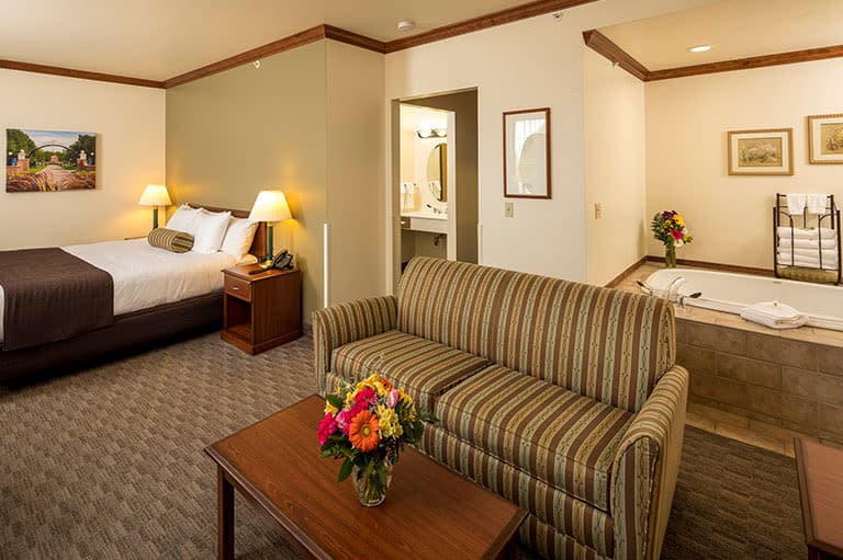 Best Door County hotels, room with bed, sofa and small coffee table