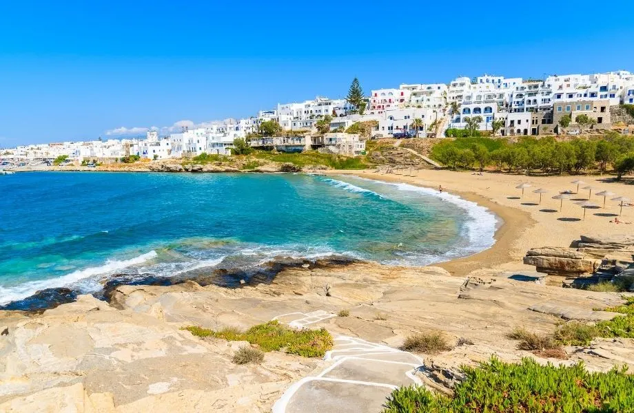 best beaches Paros has to offer this holiday season, Piperi Beach shoreline with white houses overlooking the coast