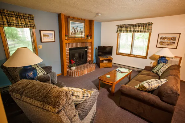 best places to stay in Door County with pets, suite living room with sofa, recliner, coffee table, tv and fireplace