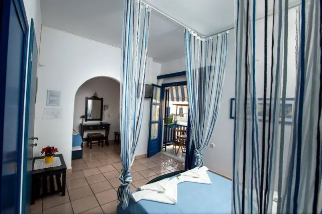 best hotels to stay at in Paros, canopy bed at Dilion Hotel