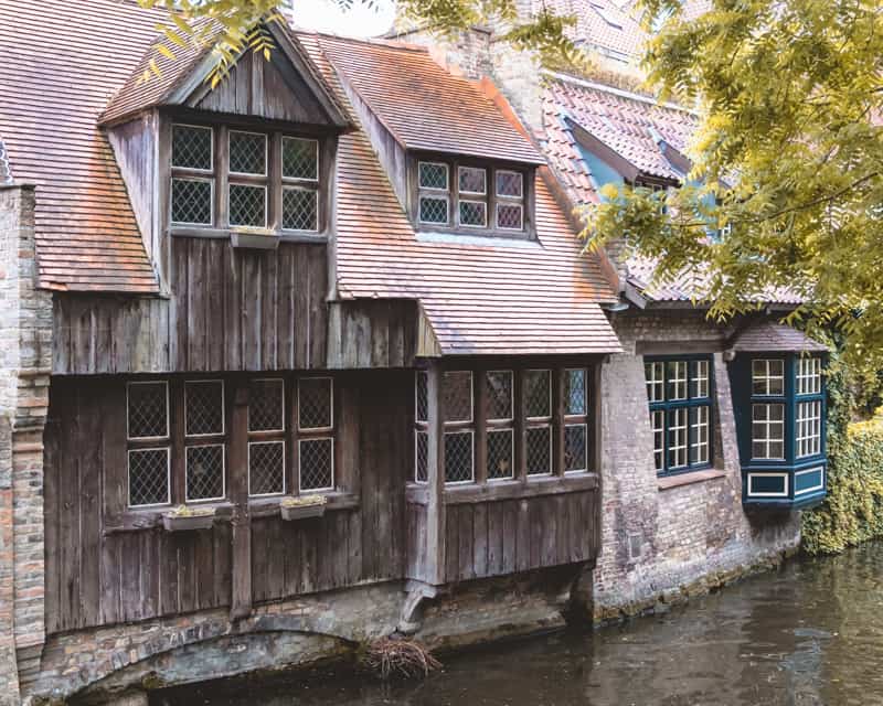 boat ride in bruges, canal cruise brugges, an old house near bruges near a canal