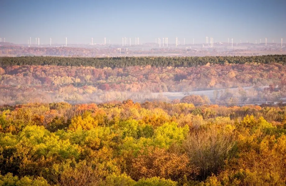 fall colors in northern wisconsin, miles of fall foliage with a city in background