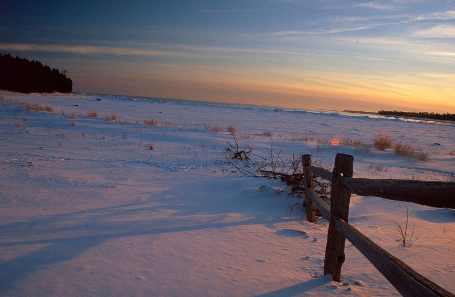 a snowly landscape during a sunset, wisconsin snowmobile trails, Bailey's Harbor in Winter